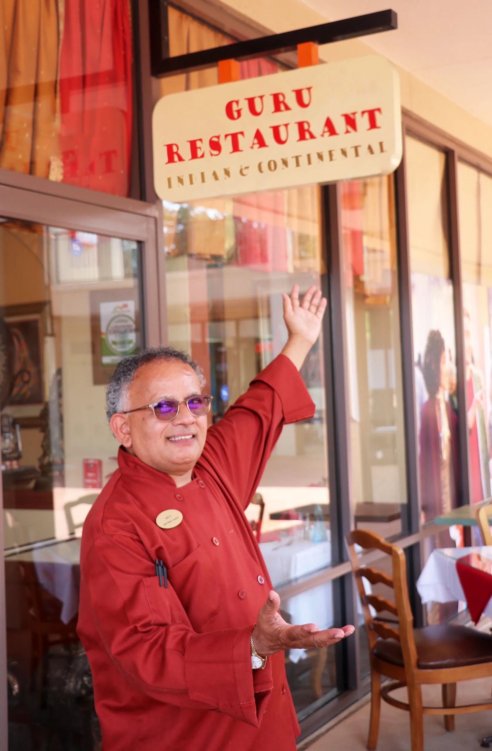 chef uday kadam hero photo posing outside the restaurant